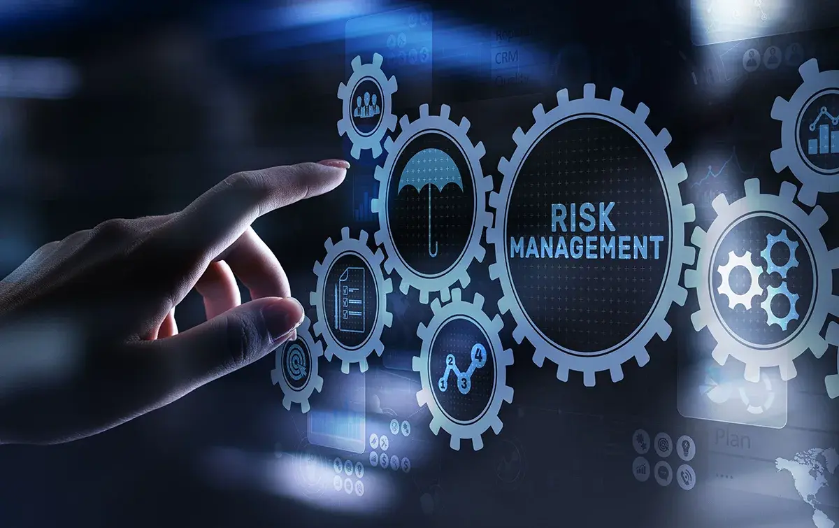 Trader managing risk while analyzing financial market charts.